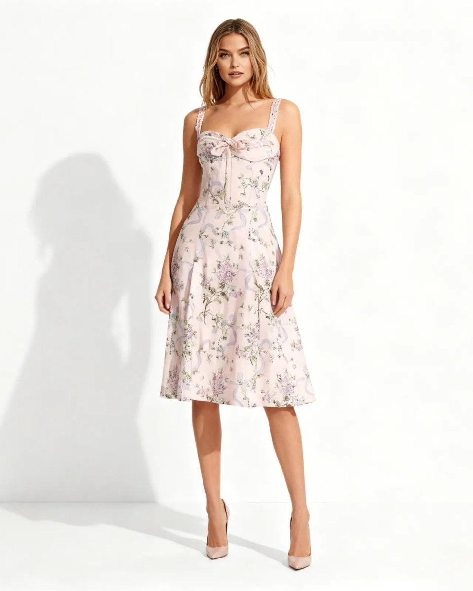 Model wearing the pink floral midi dress with sweetheart neckline, shown from the front against a white background.