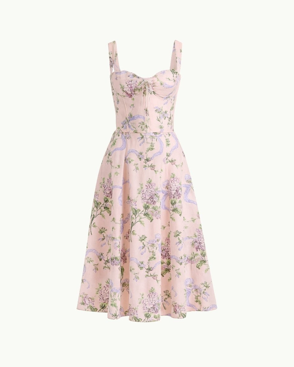 Close-up detail of the sweetheart neckline, tie-front feature, and jacquard fabric of the yellow rose floral midi dress.
