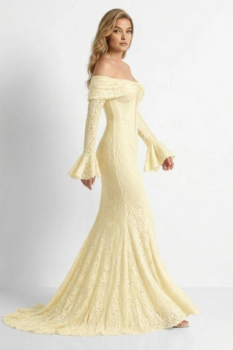 Side angle view of cream yellow lace mermaid silhouette evening gown showing fitted bodice and flared hem