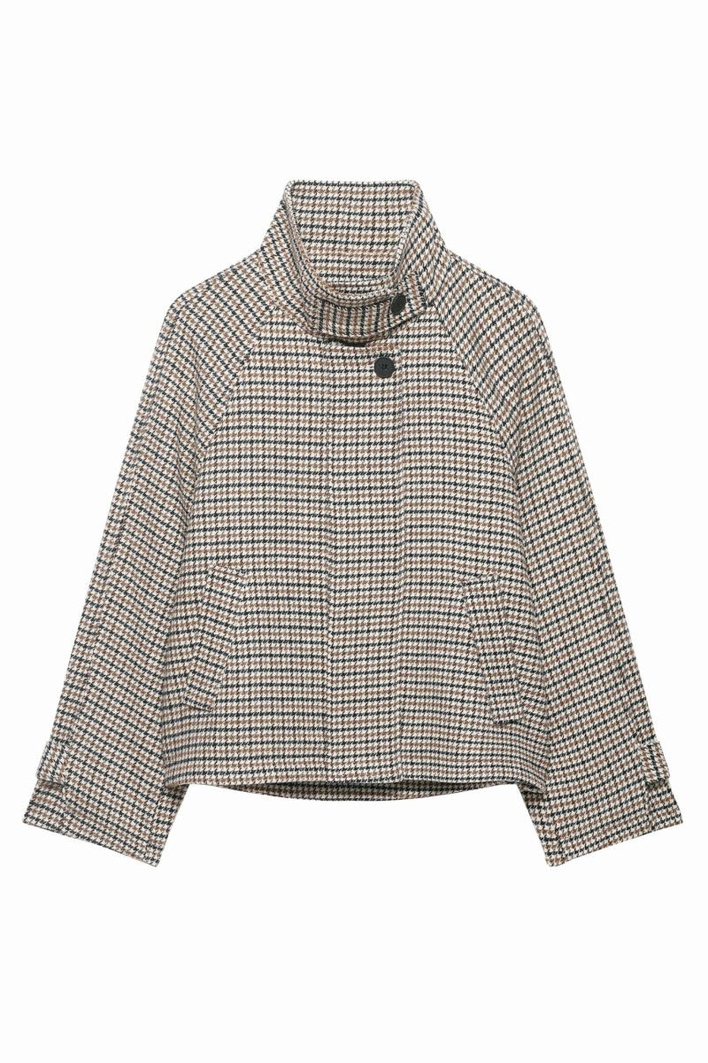 Ghost mannequin front view of a buttoned-up cropped houndstooth jacket with a funnel neck and raglan sleeves on a white background.