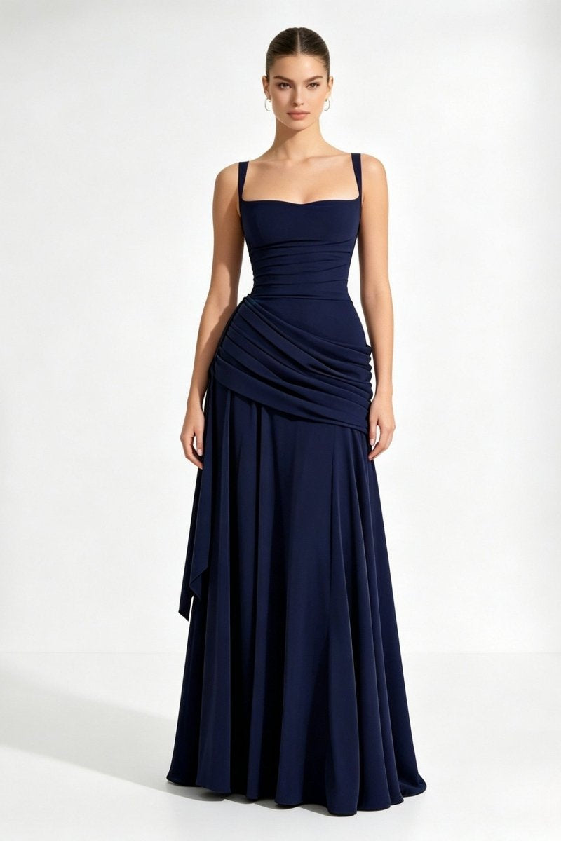 Woman modeling a dark blue square neck formal evening gown with ruched waist by Fenlo Form, standing facing forward.