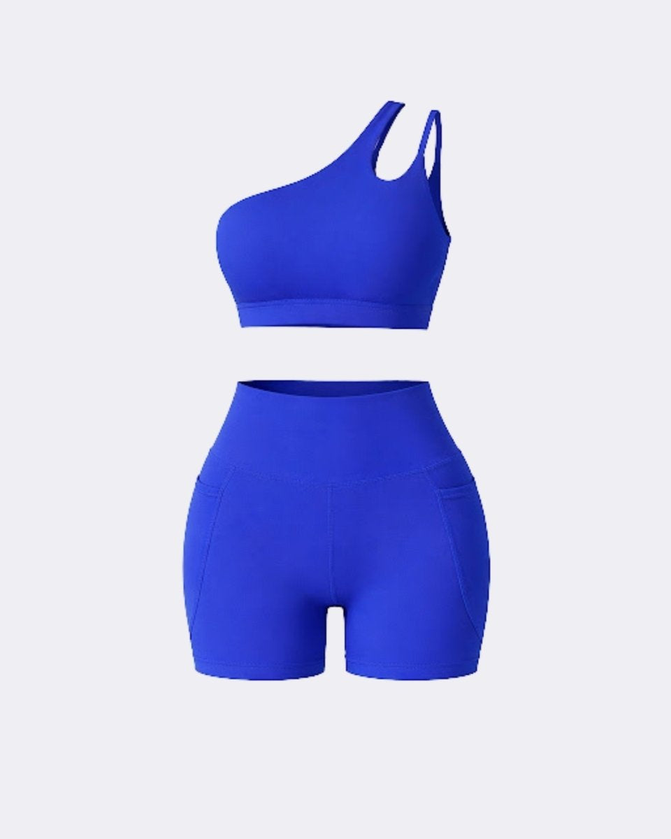 Ghost mannequin front view of dark blue two piece workout set featuring one shoulder cutout bra and pocket biker shorts