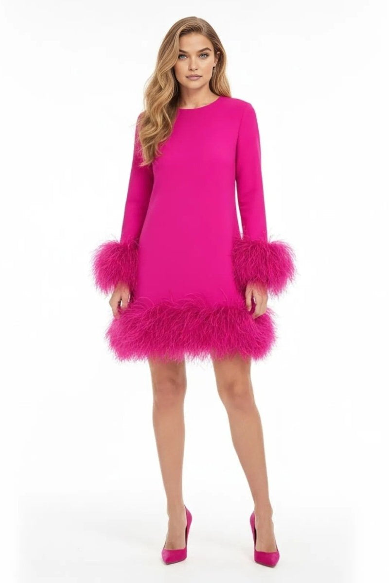 Model wearing the Kouvr dark pink long sleeve mini dress with genuine ostrich feather trim on the cuffs and hem.