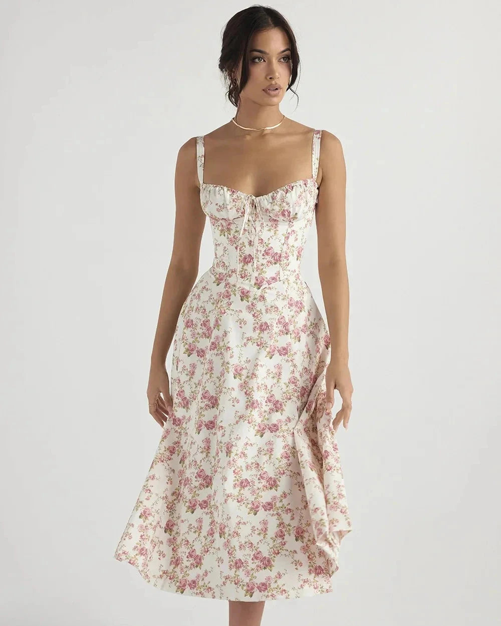 Woman wearing a floral dress on a white background