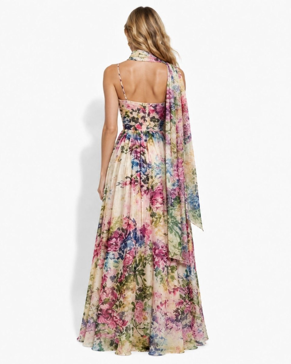 Full back view of the designer wedding guest dress highlighting the sweeping A-line skirt and delicate back strap detailing.