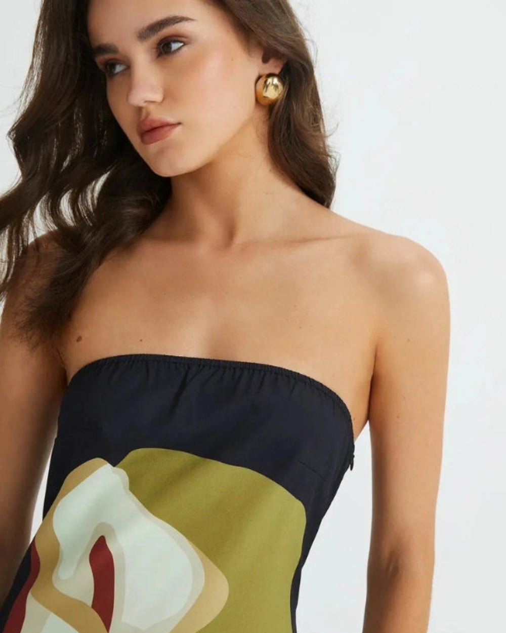Model wearing the Elizabeth abstract floral strapless evening dress