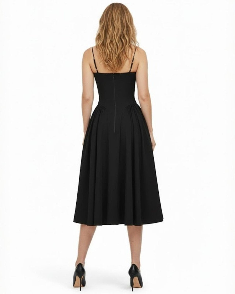 Back view of the Evdokia black cocktail dress, displaying the spaghetti straps and concealed zipper closure on the fitted bodice.