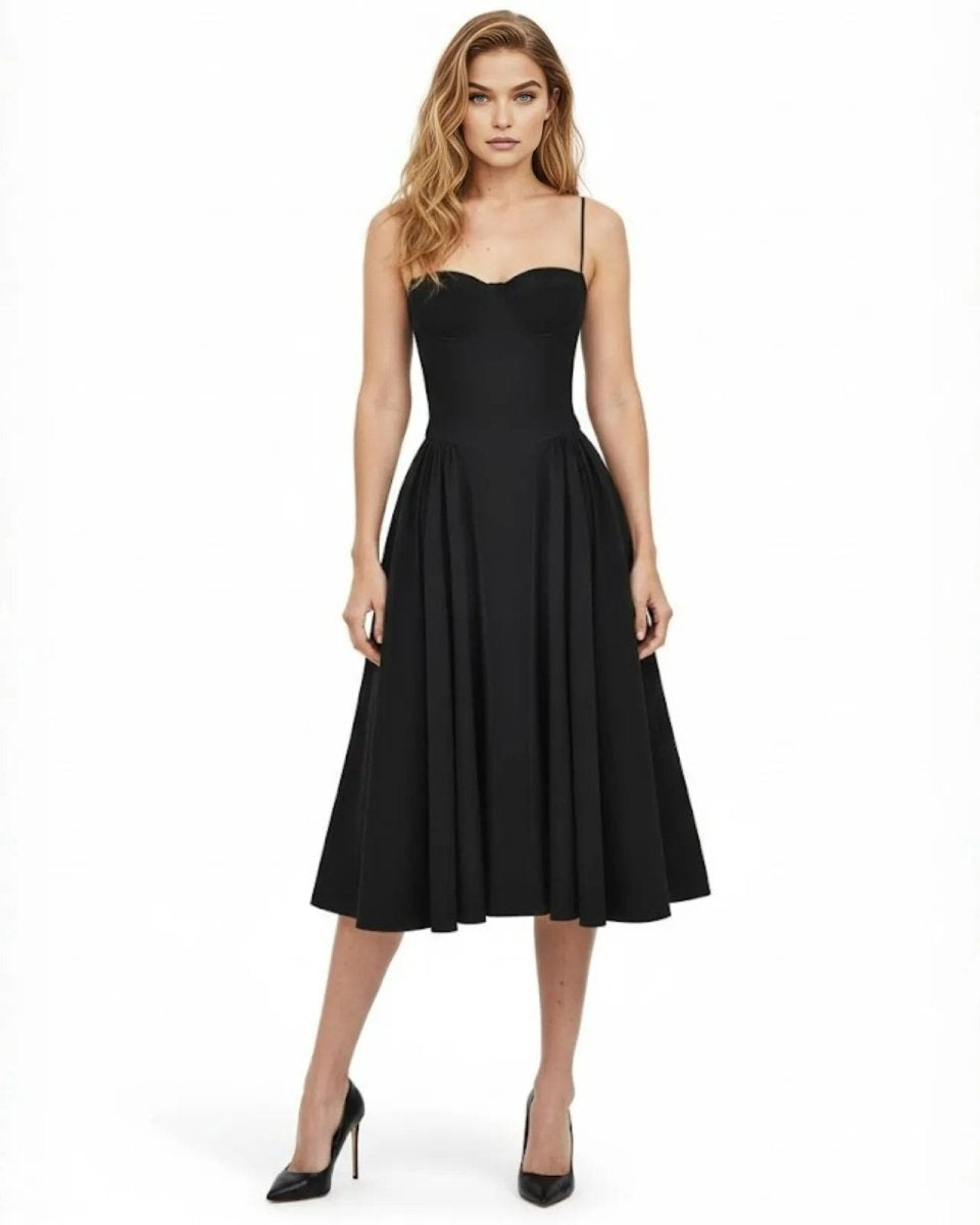 Model wearing the Evdokia black midi dress, showcasing its sweetheart neckline, fitted corset bodice, and full A-line skirt.