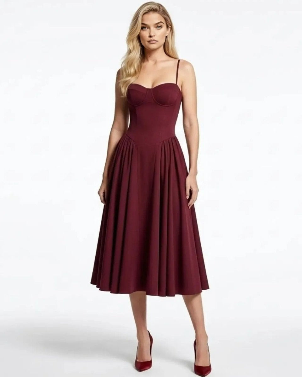 Model wearing the Evdokia burgundy bustier midi dress with a sweetheart neckline and full A-line skirt