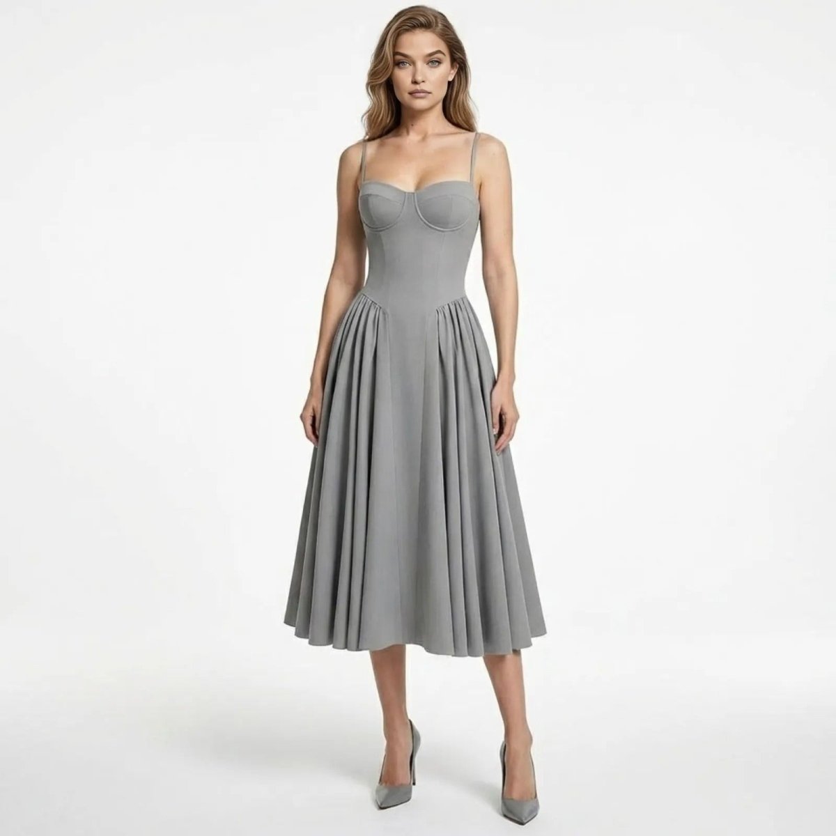 Model wearing the grey Evdokia corset midi dress, featuring a structured bustier top and full pleated A-line skirt.