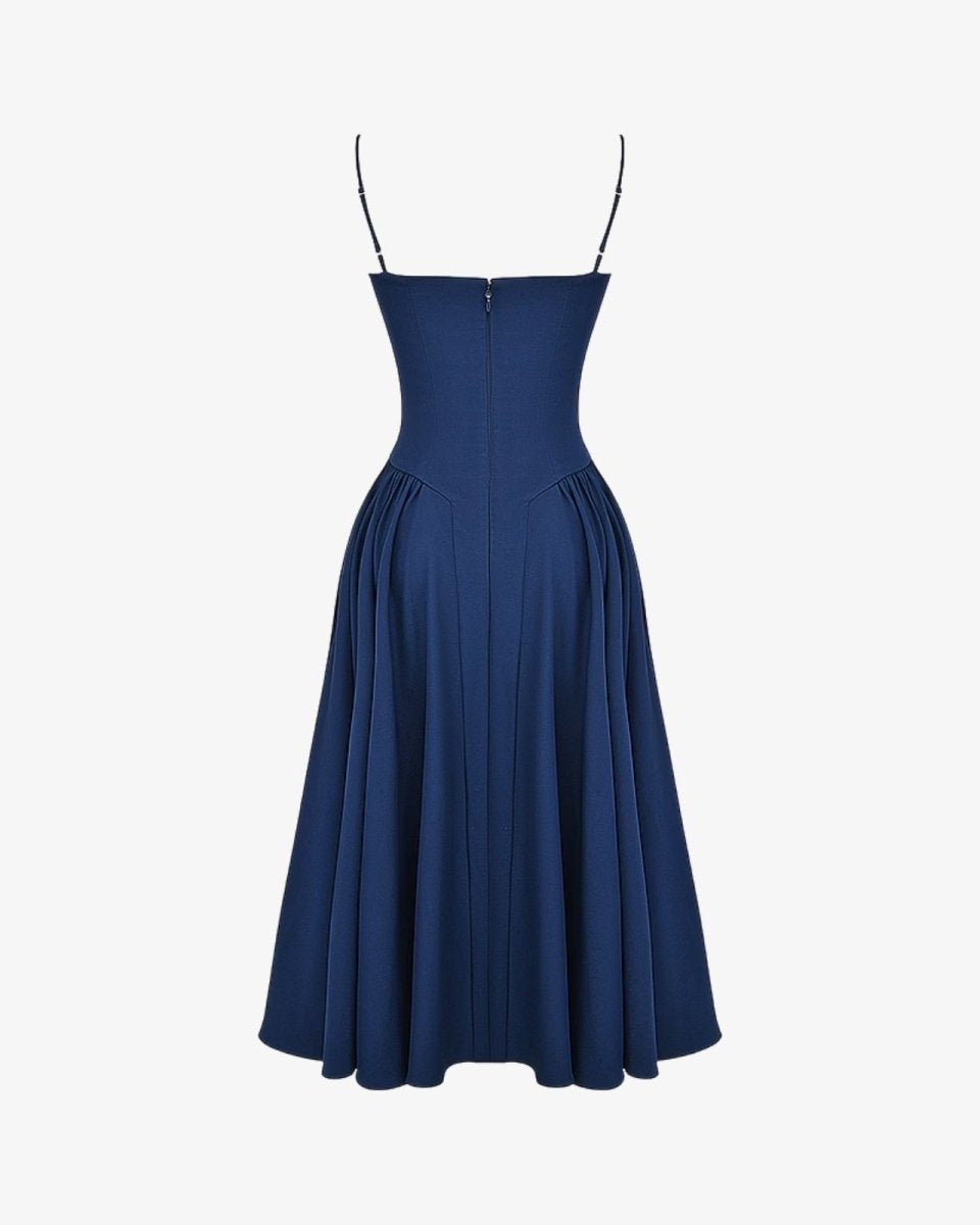 Product-only image of the back of the Evdokia midi dress, detailing the pleated construction of the skirt and the back of the bodice.