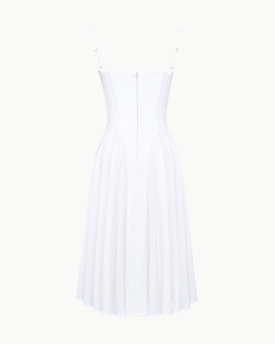 Product-only photo of the back of the Evdokia white corset midi dress, showing the zipper and strap construction.