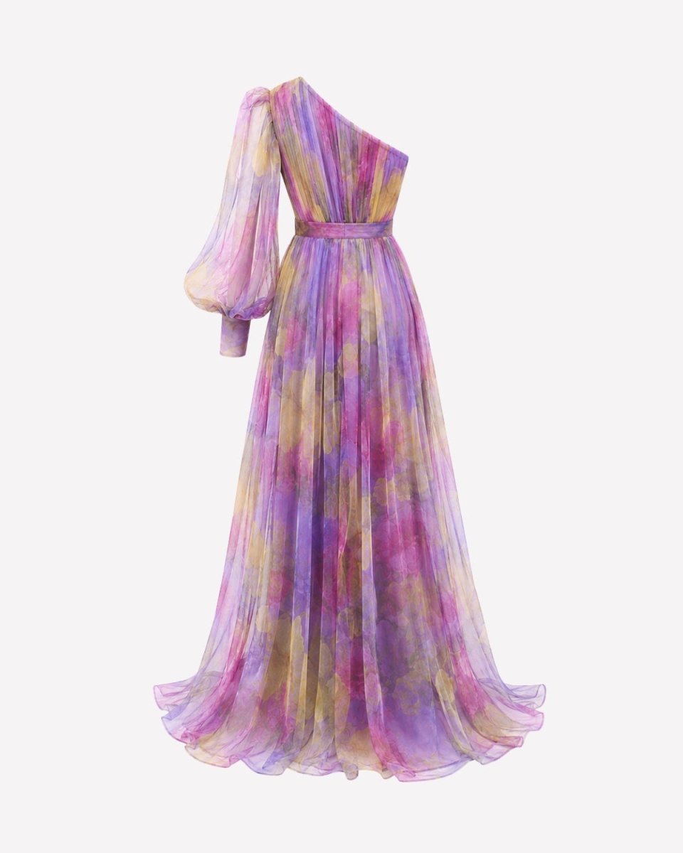 A one-shoulder long dress with a flowing skirt, featuring a watercolor tie-dye pattern in shades of purple, pink, yellow, and blue on a light gray background.