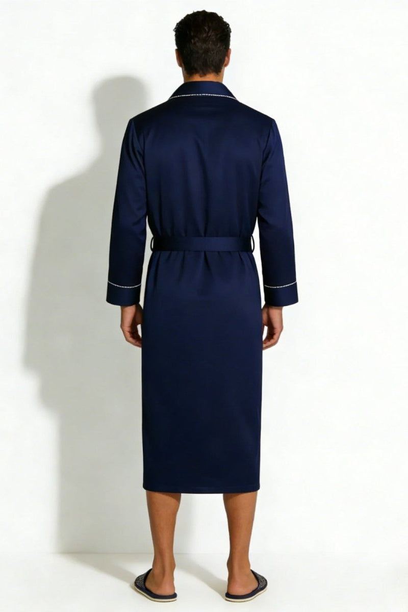 Back view of a man modeling a classic navy blue silk robe with a tie belt, showing the elegant drape of the fabric.