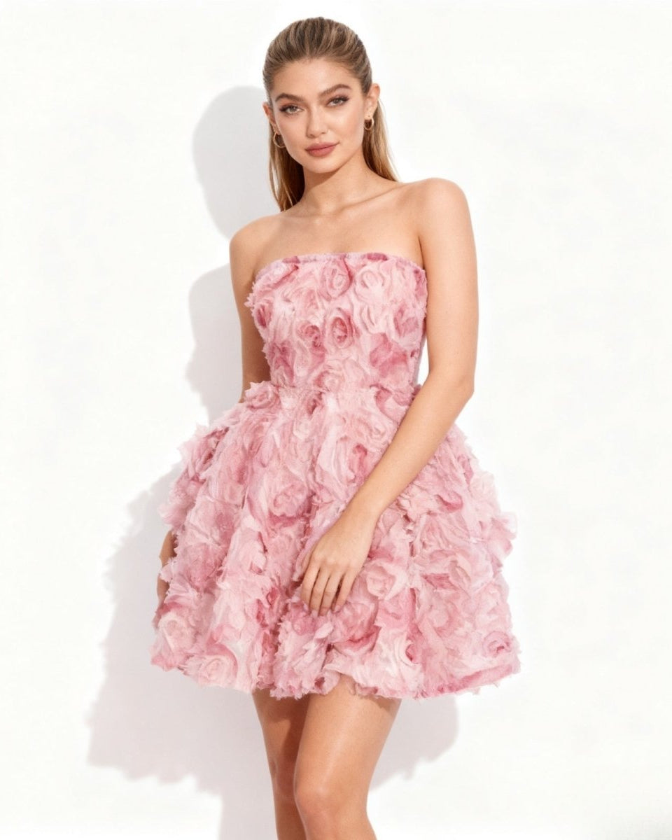 Model wearing the Fenlo Form strapless pink 3D rosette mini dress, viewed from the front.