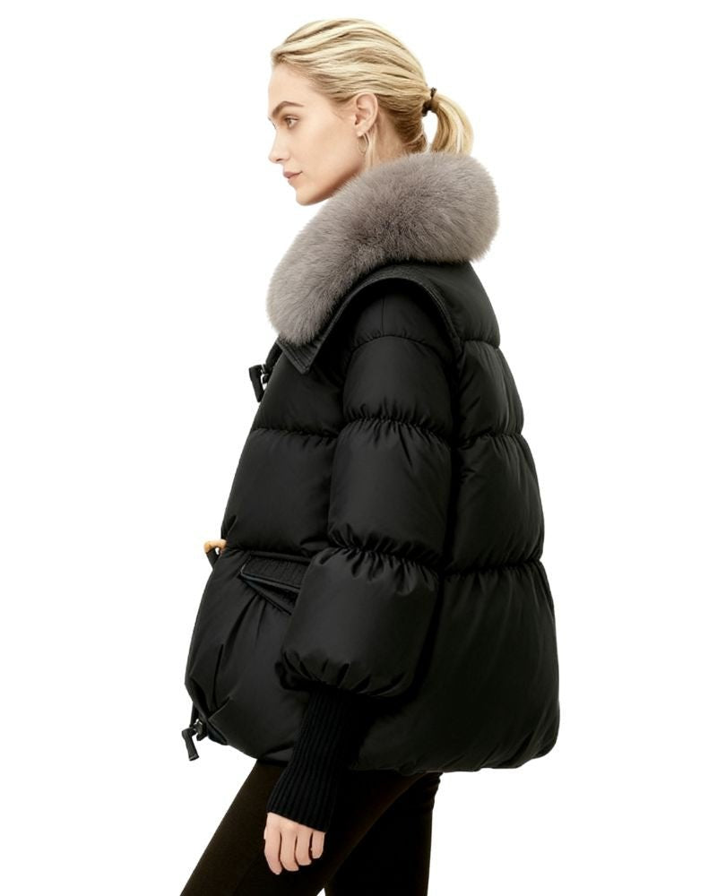Black fenlo form puffer jacket with fur hood worn by a person on a white background