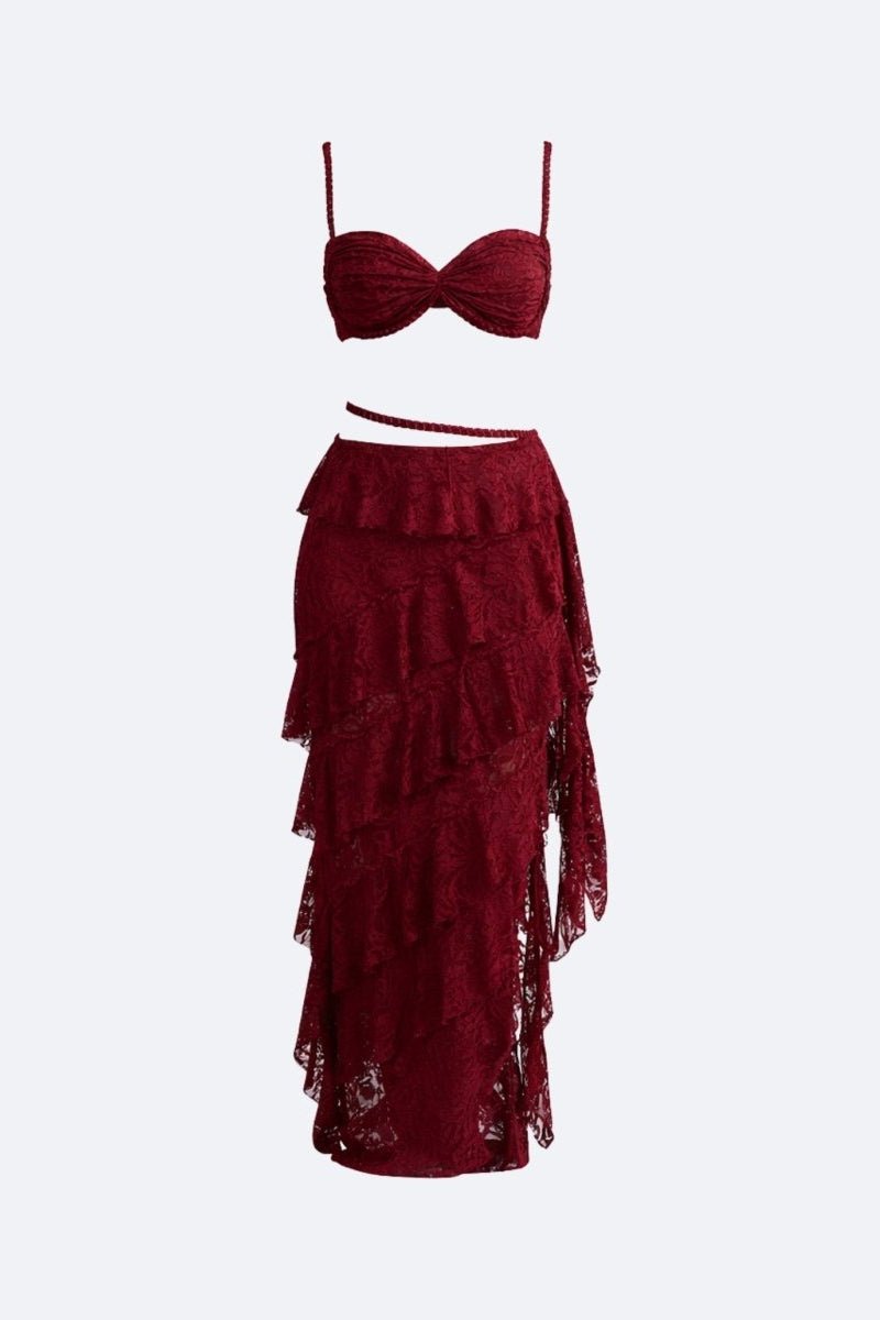 Red two-piece outfit with a top and ruffled skirt on a white background