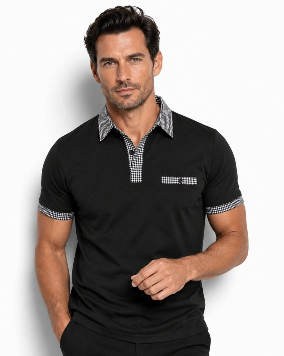 Man wearing a black polo shirt with checkered details on a white background