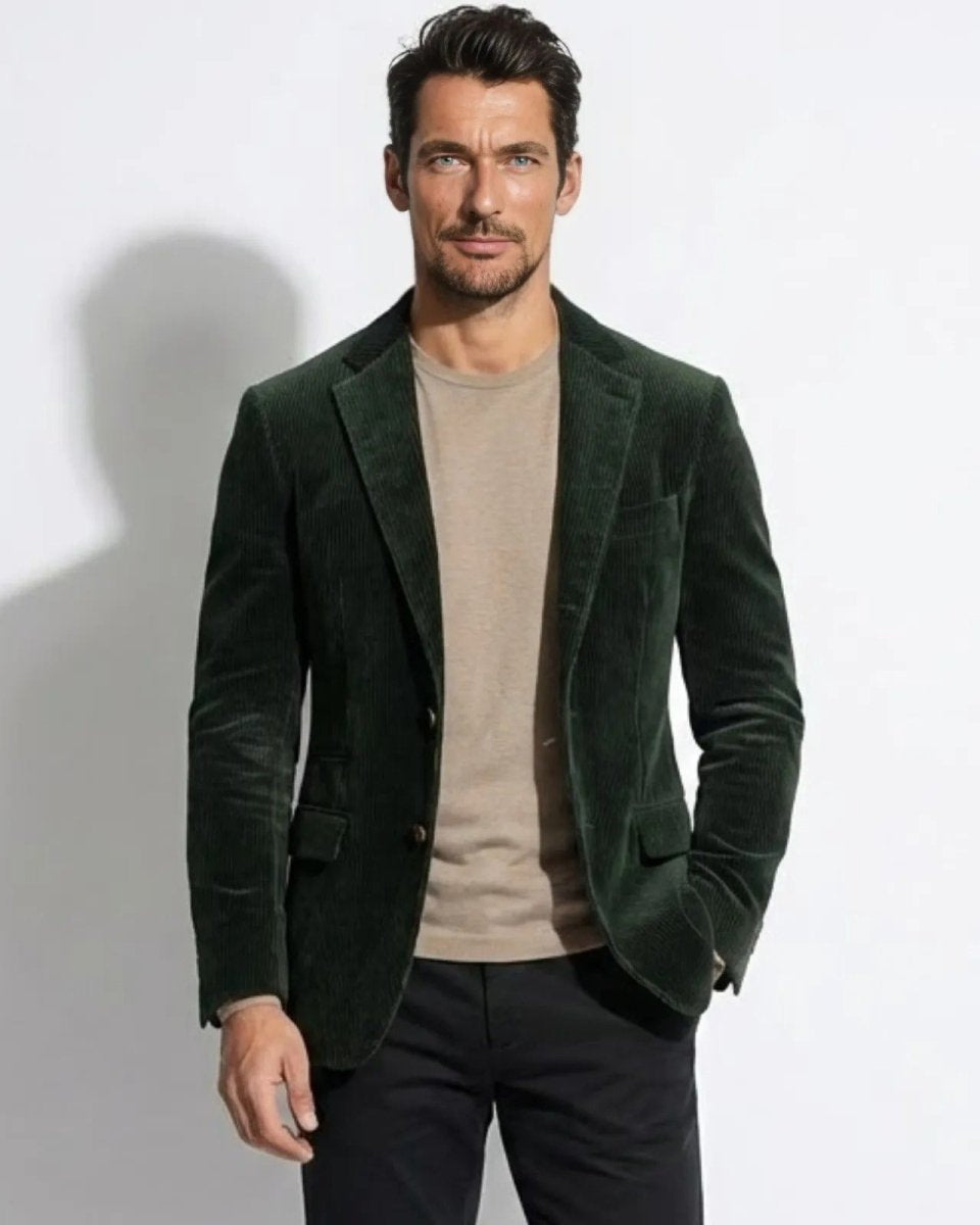 Model wearing the men's dark green grady blazer with a beige t-shirt and black trousers, showcasing its slim tailored fit.