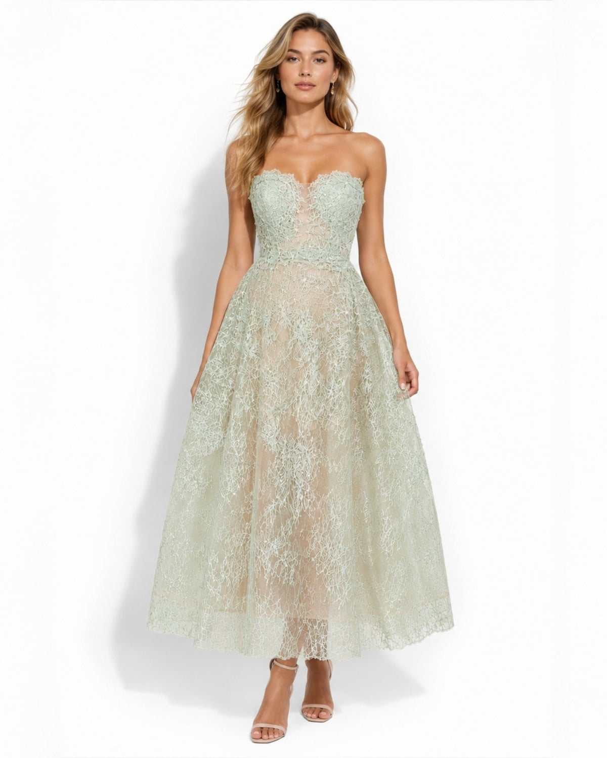 Front view of woman wearing luxury sage green strapless floral lace midi dress with sweetheart corset bodice for spring wedding guest attire.