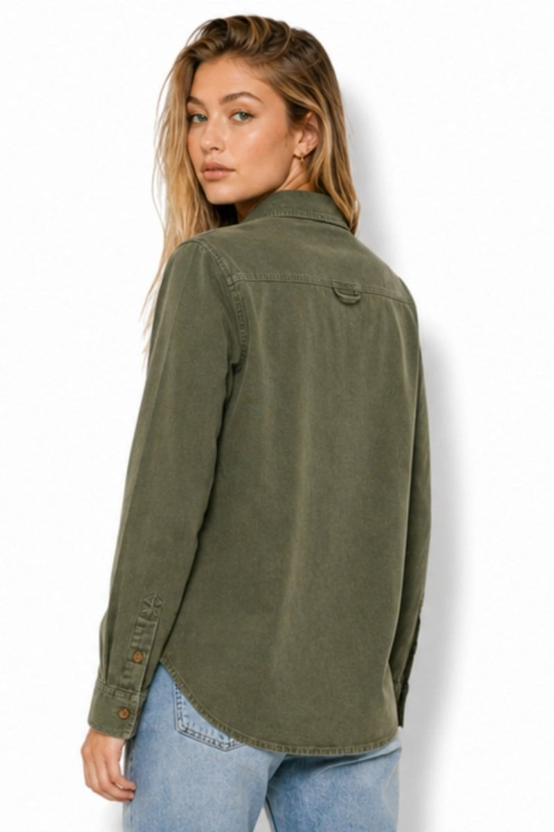 Back view of an olive green sueded cotton button down shirt showing yoke and curved hem details
