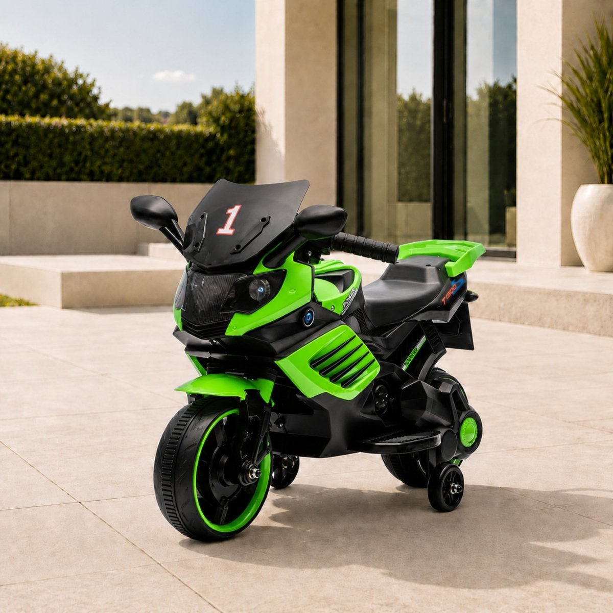 Vibrant green luxury kids 6V electric motorcycle with training wheels parked elegantly on an outdoor patio.