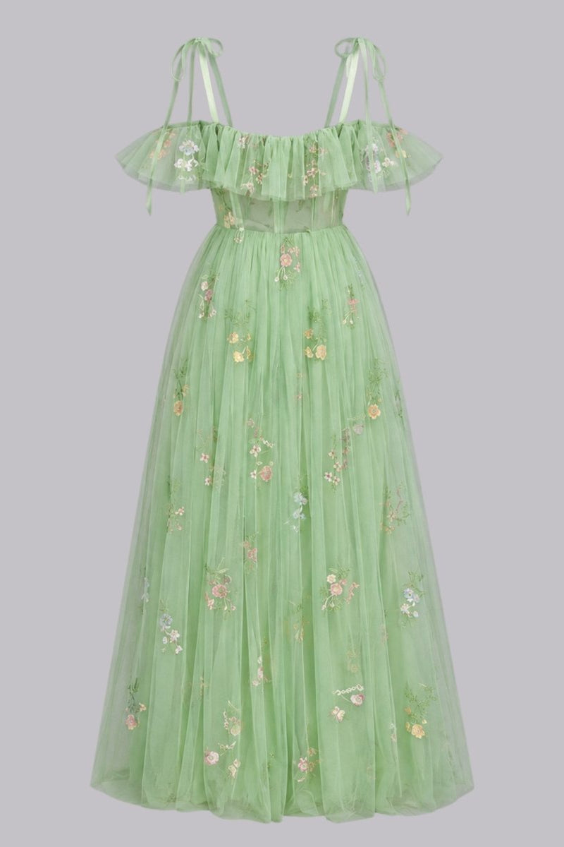 Isolated product view of full length green floral embroidered tulle corset gown against a light grey background.
