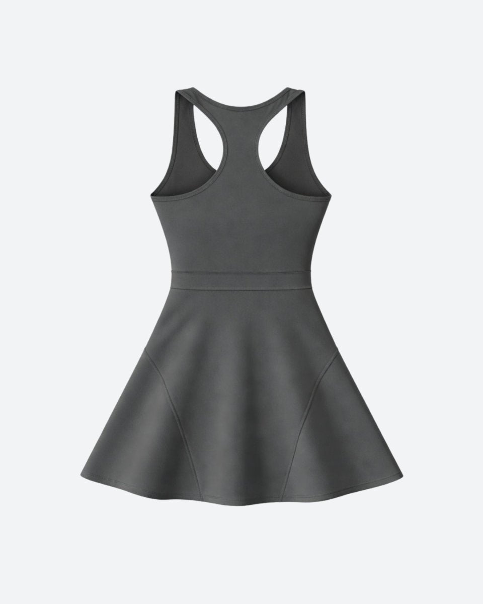 Studio product shot of a grey racerback athletic dress with paneled skirt detail