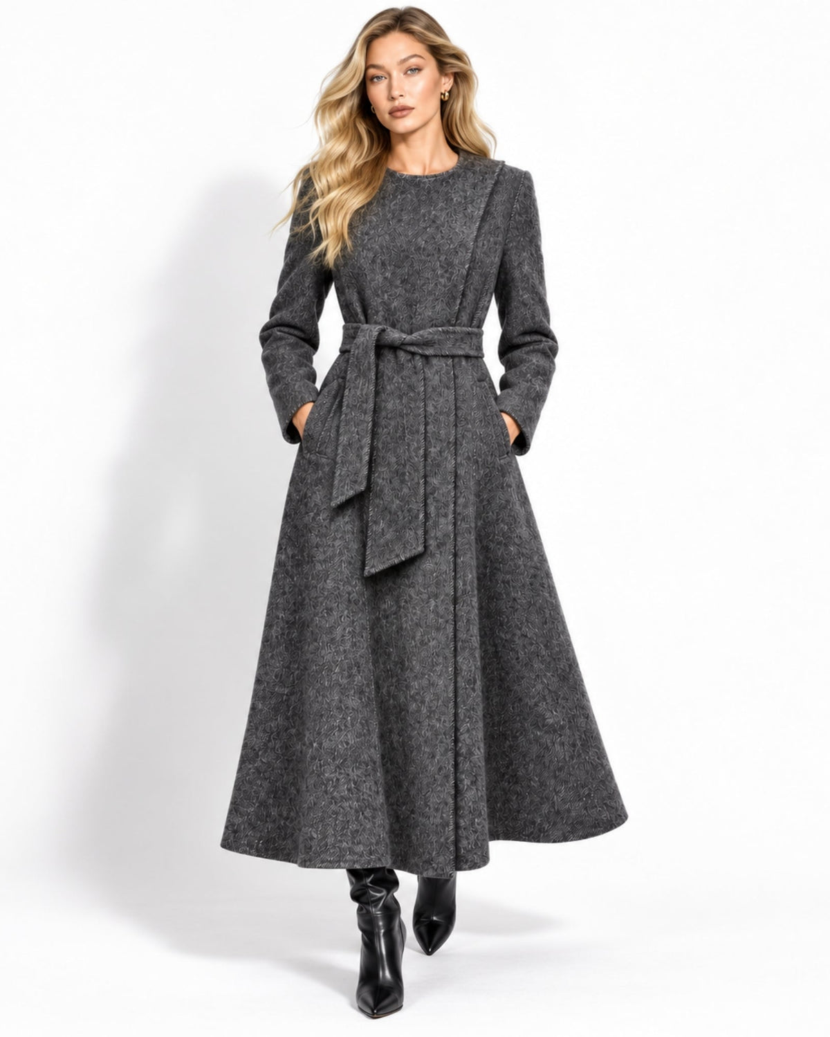 Front view of women's luxury long charcoal grey wrap coat featuring a tie waist, asymmetric collar, and textured fabric.