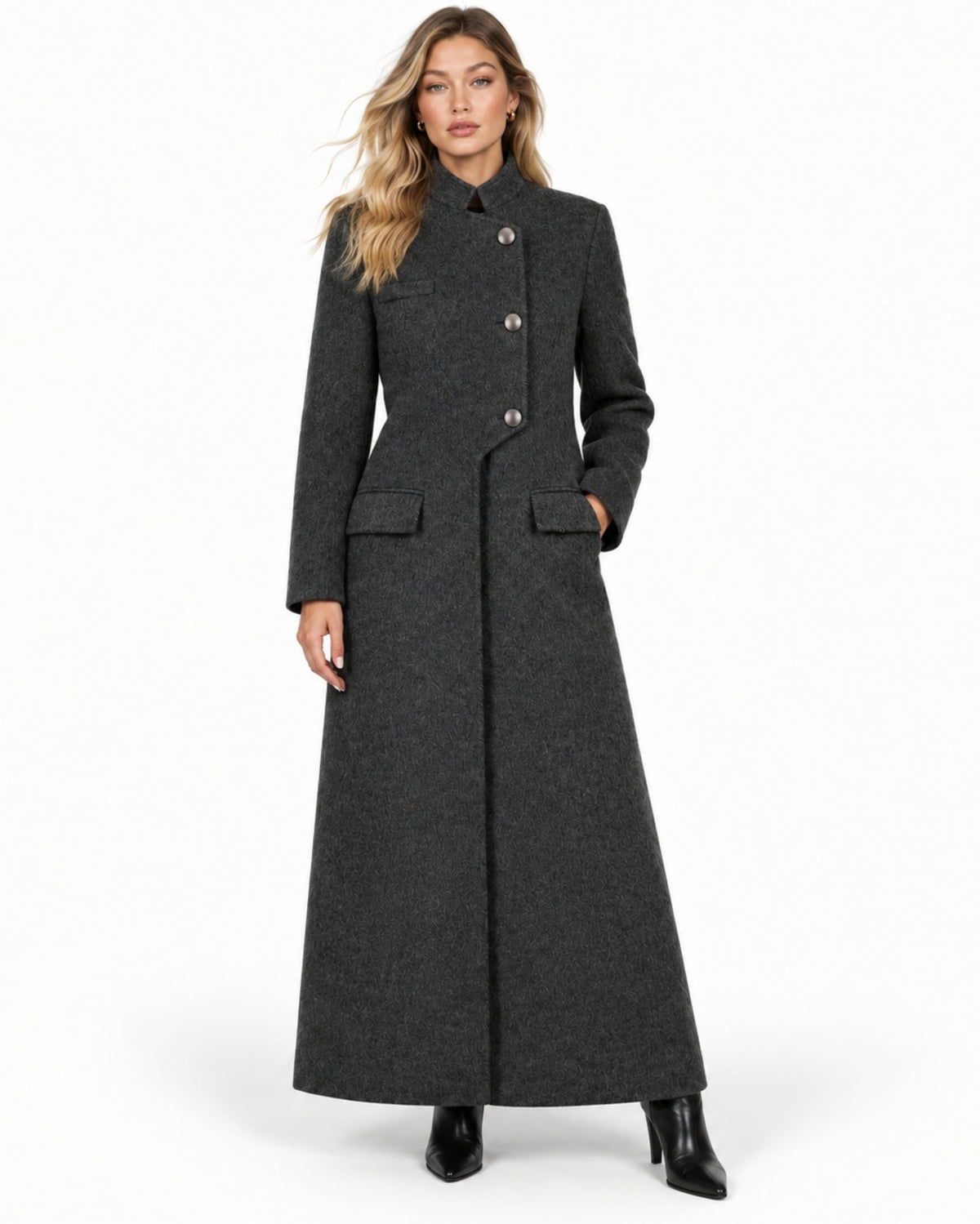 Front view of woman wearing asymmetrical charcoal grey long tailored wool winter coat with stand collar.