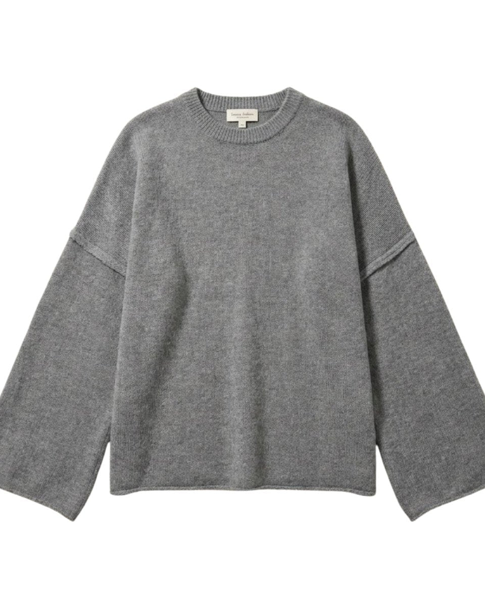 Flat lay of the grey bell sleeve sweater showcasing the texture of the cashmere wool knit and exposed seams.