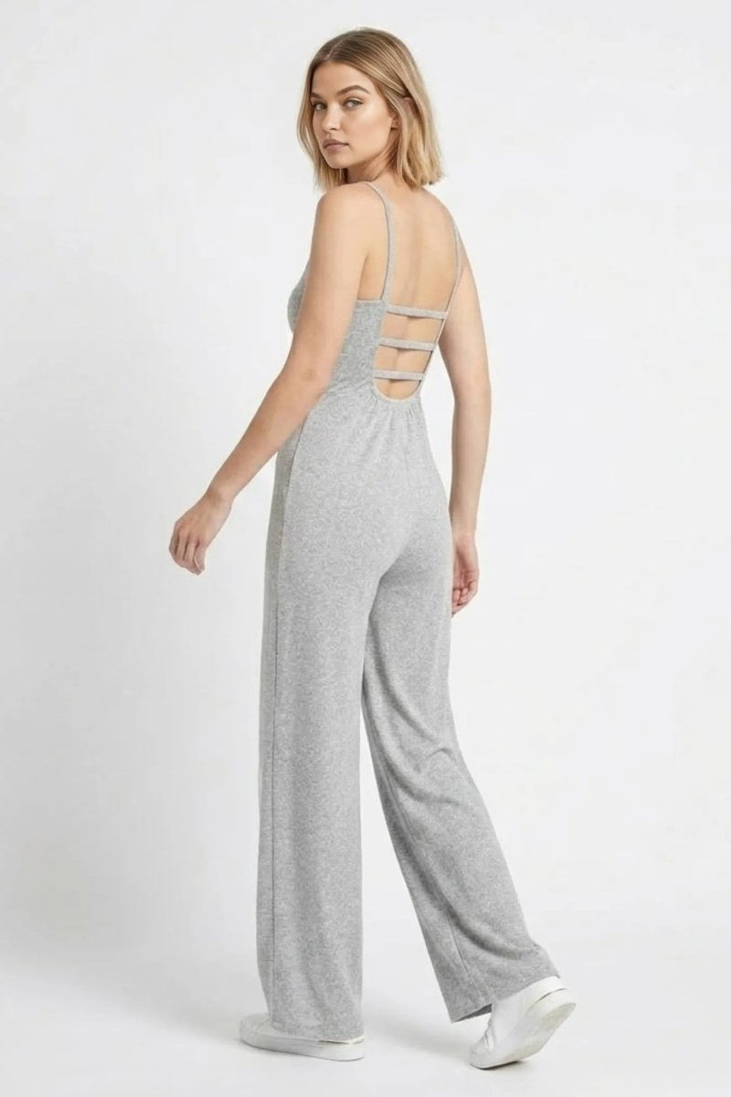 Back view highlighting the ladder strappy open back detail of the grey wide leg knit jumpsuit by Fenlo Form