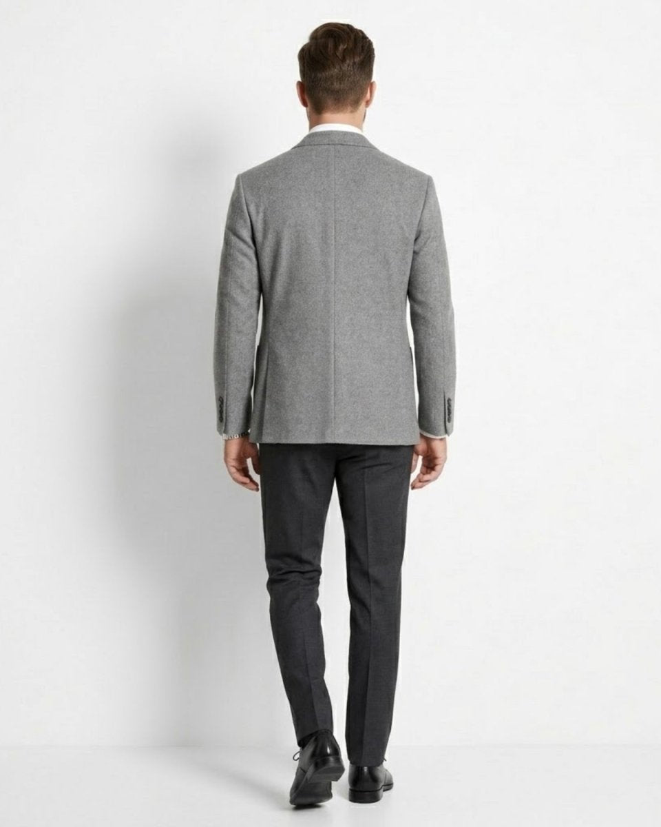 Man wearing a gray suit on a white background