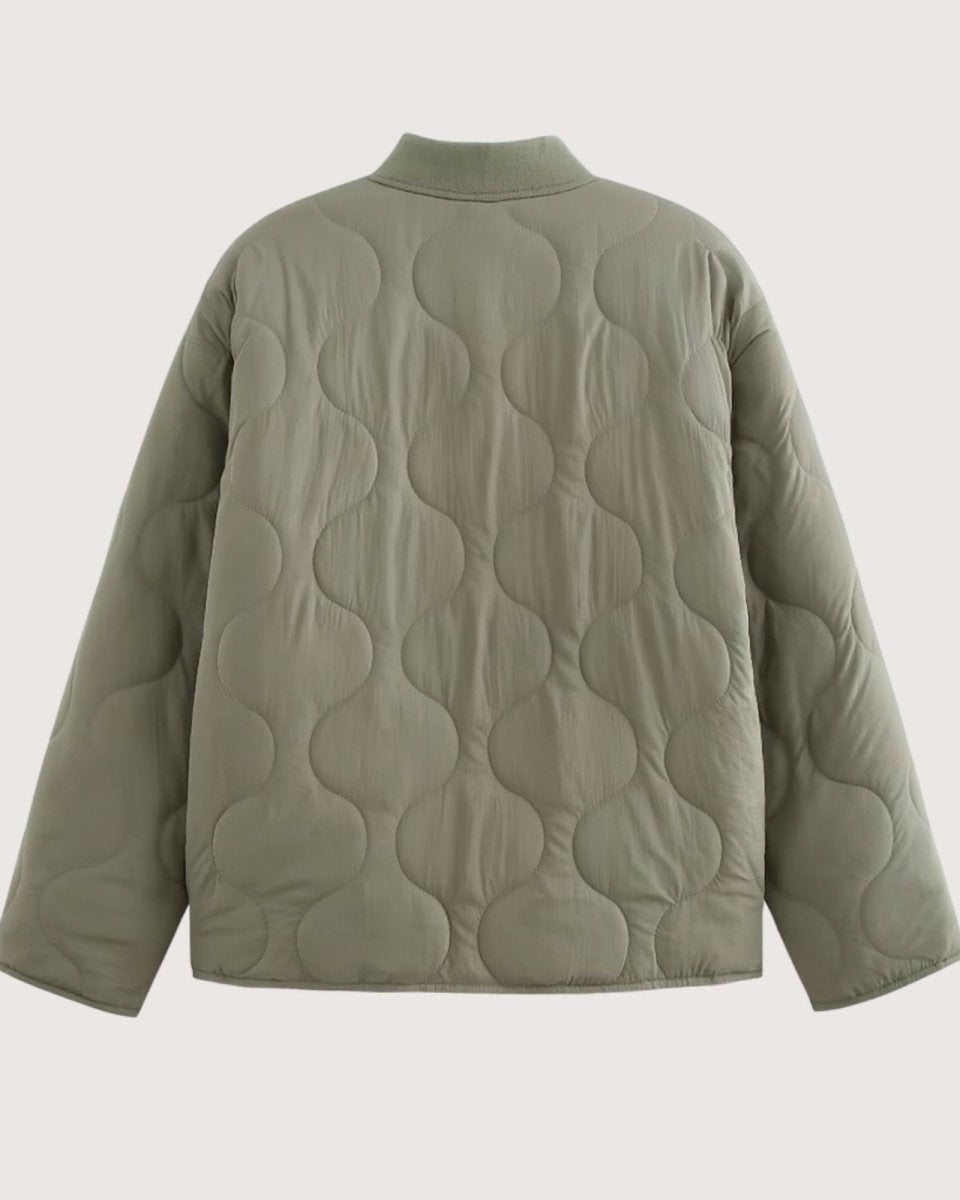 Flat lay of the back of the Harmony quilted jacket in sage green, detailing the continuous, elegant onion quilting pattern.