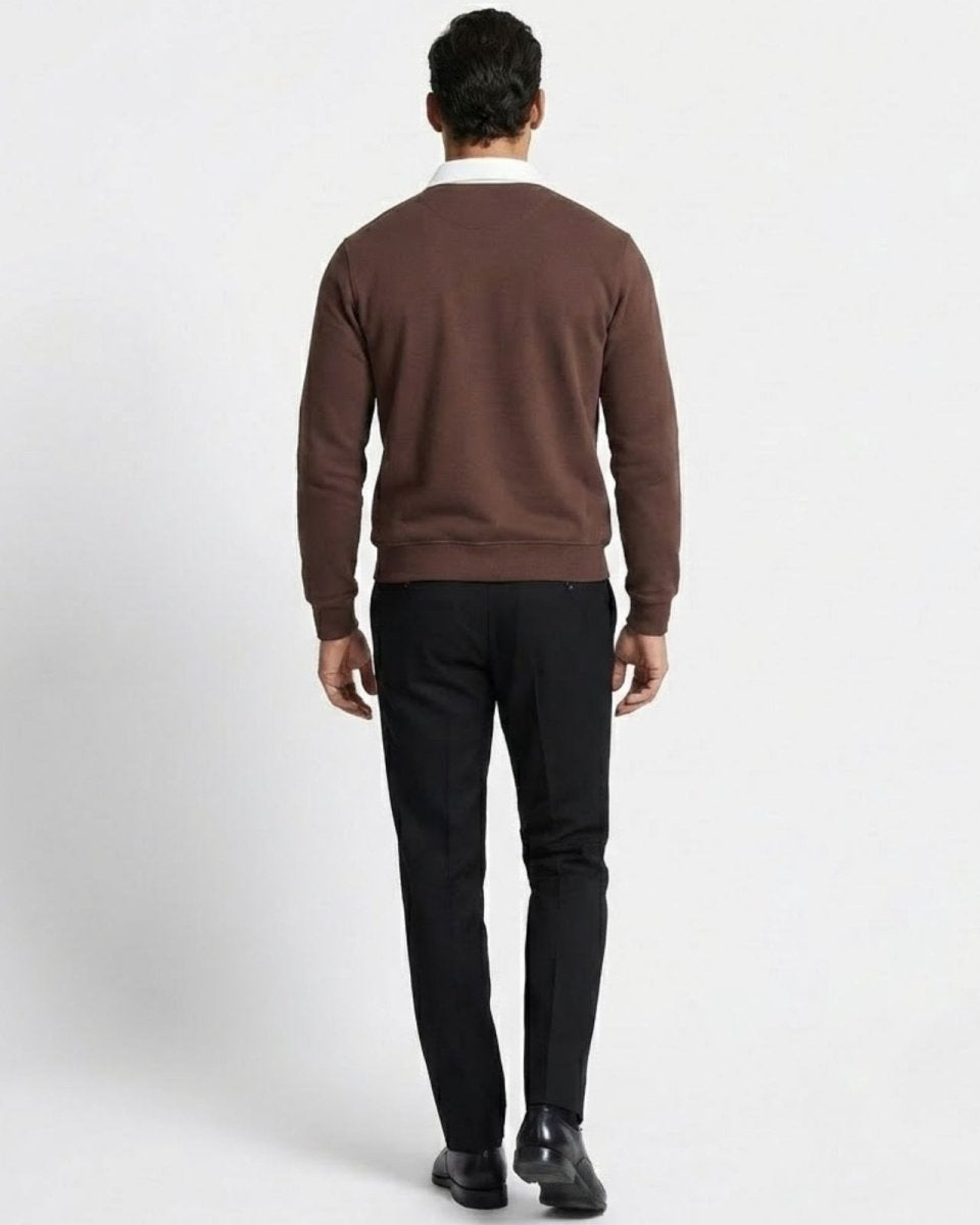 Back view of a man wearing the Rhodes dark brown long sleeve polo sweater, displaying the fit across the shoulders and back.
