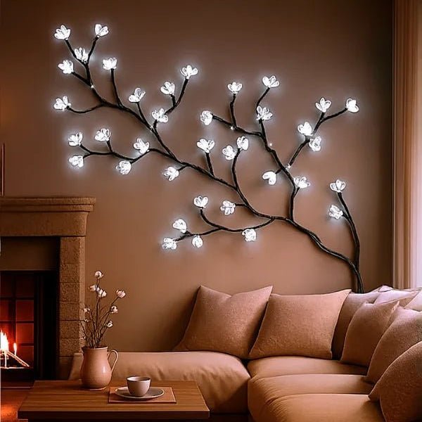 Decorative wall light fixture resembling illuminated branches in a cozy living room.
