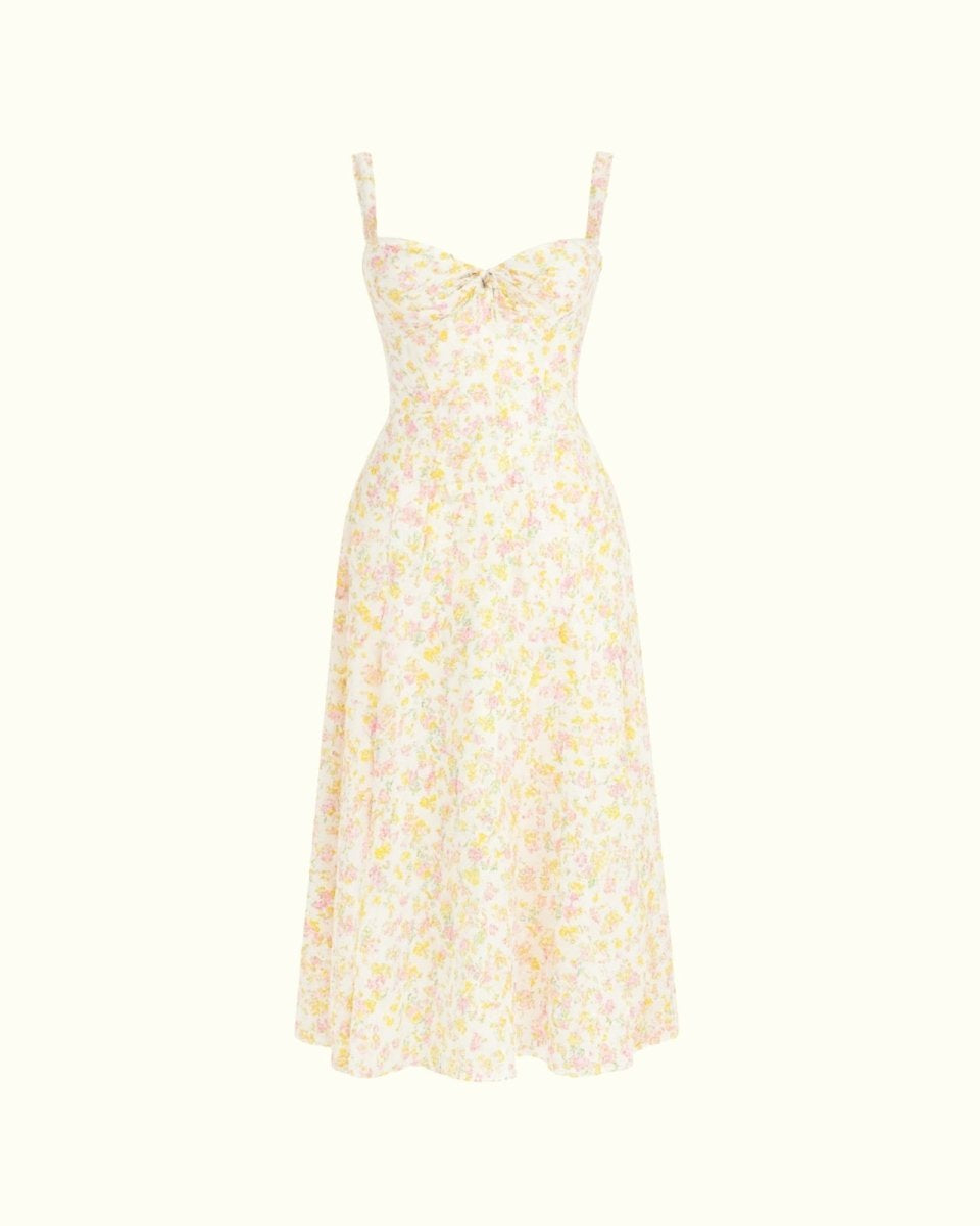 Close-up detail of the sweetheart neckline, tie-front feature, and jacquard fabric of the yellow rose floral midi dress.