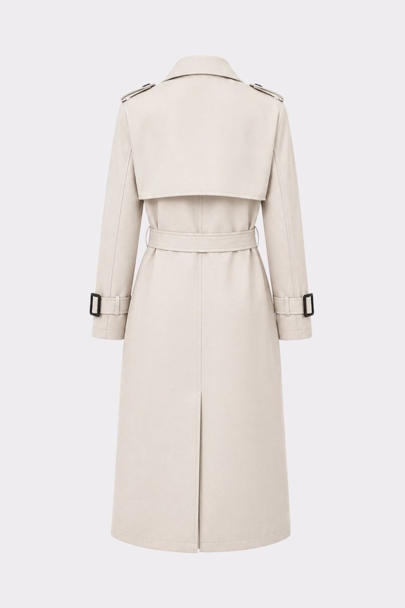 Back detail product shot of a ivory trench coat showing structured shoulder epaulettes, upper back storm flap, and adjustable belted sleeve cuffs.