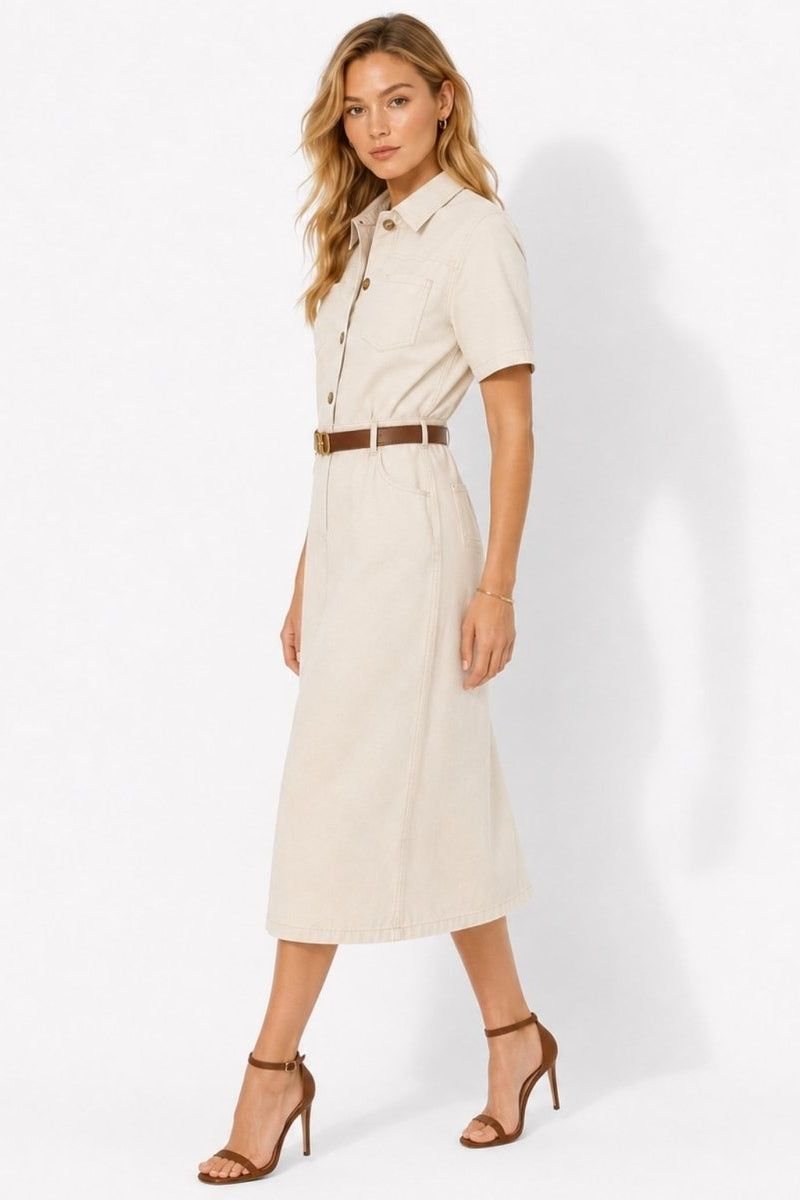 Side profile of woman in ivory belted button down midi dress showing tailored fit and short sleeves by Kouvr.