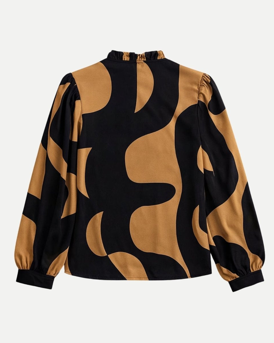 Flat lay of the back of the Judith blouse, highlighting the ruffled mock-neck collar detail and gathered shoulders.
