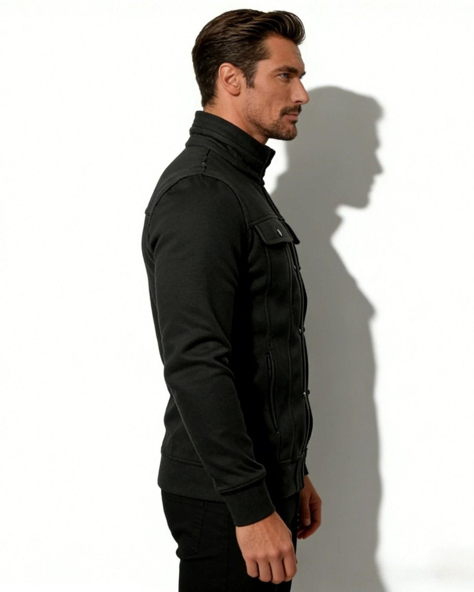 Side profile of a man in a Kent black structured knit jacket, showing the slim fit and tailored silhouette.