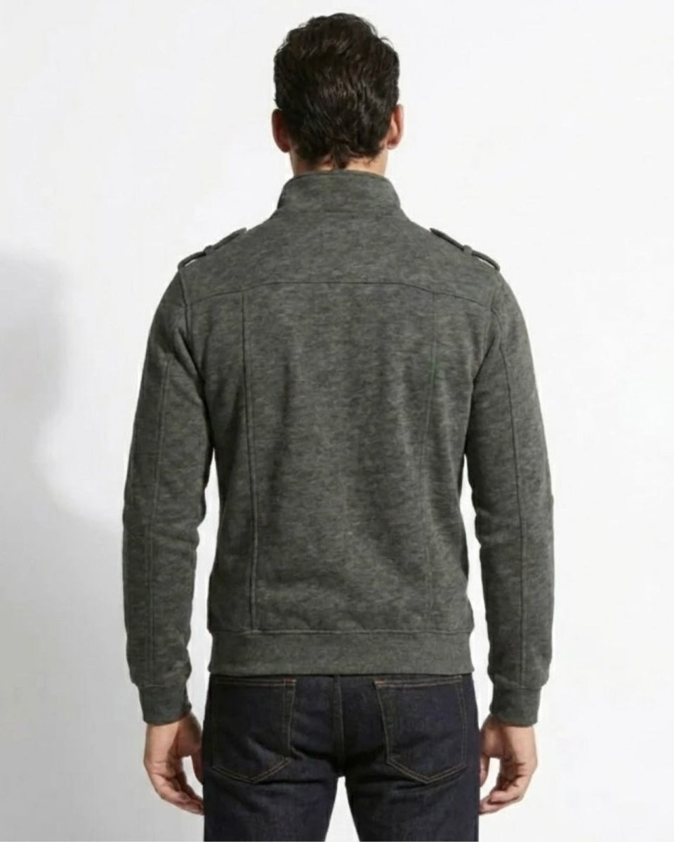 Back view of a model in the Kent dark grey military jacket highlighting the structured shoulder and seam details.