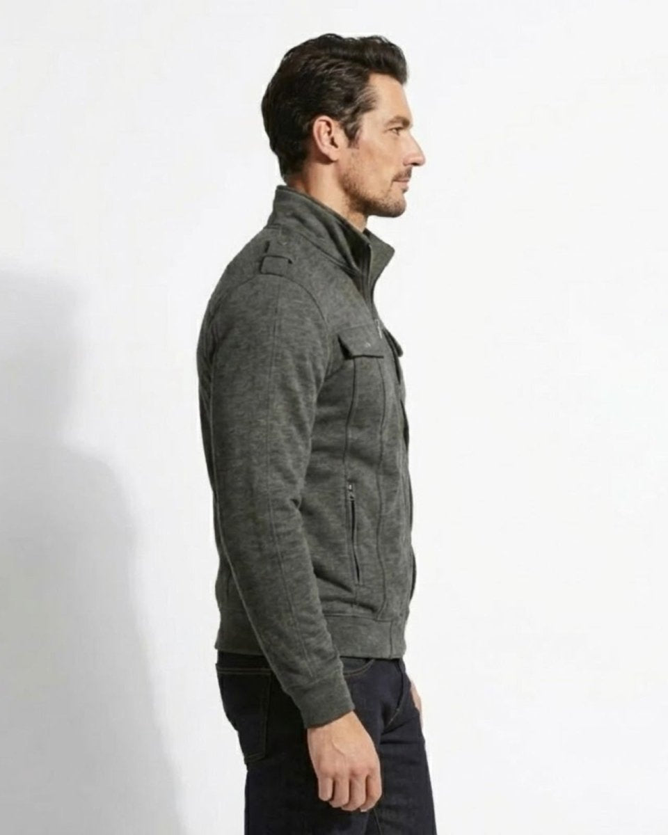 Side profile of a model wearing the slim fit Kent military jacket in dark grey showing the stand collar detail.