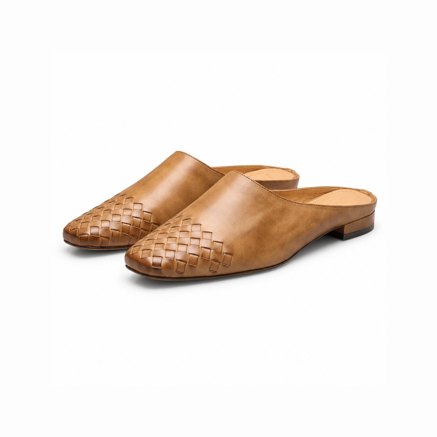 Close up pair woven leather square toe flat mules for women featuring a low stacked heel