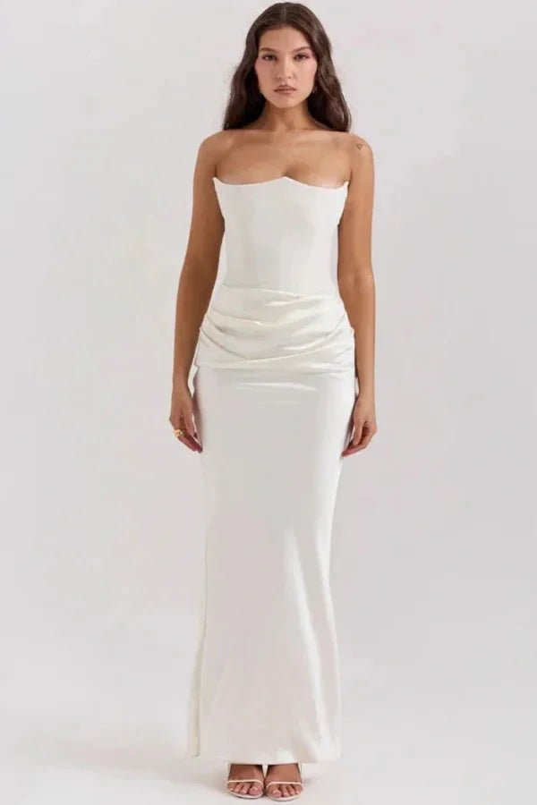 Model wearing the Zanayah white strapless corset maxi dress with ruched satin detail from Kouvr, shown from the front.
