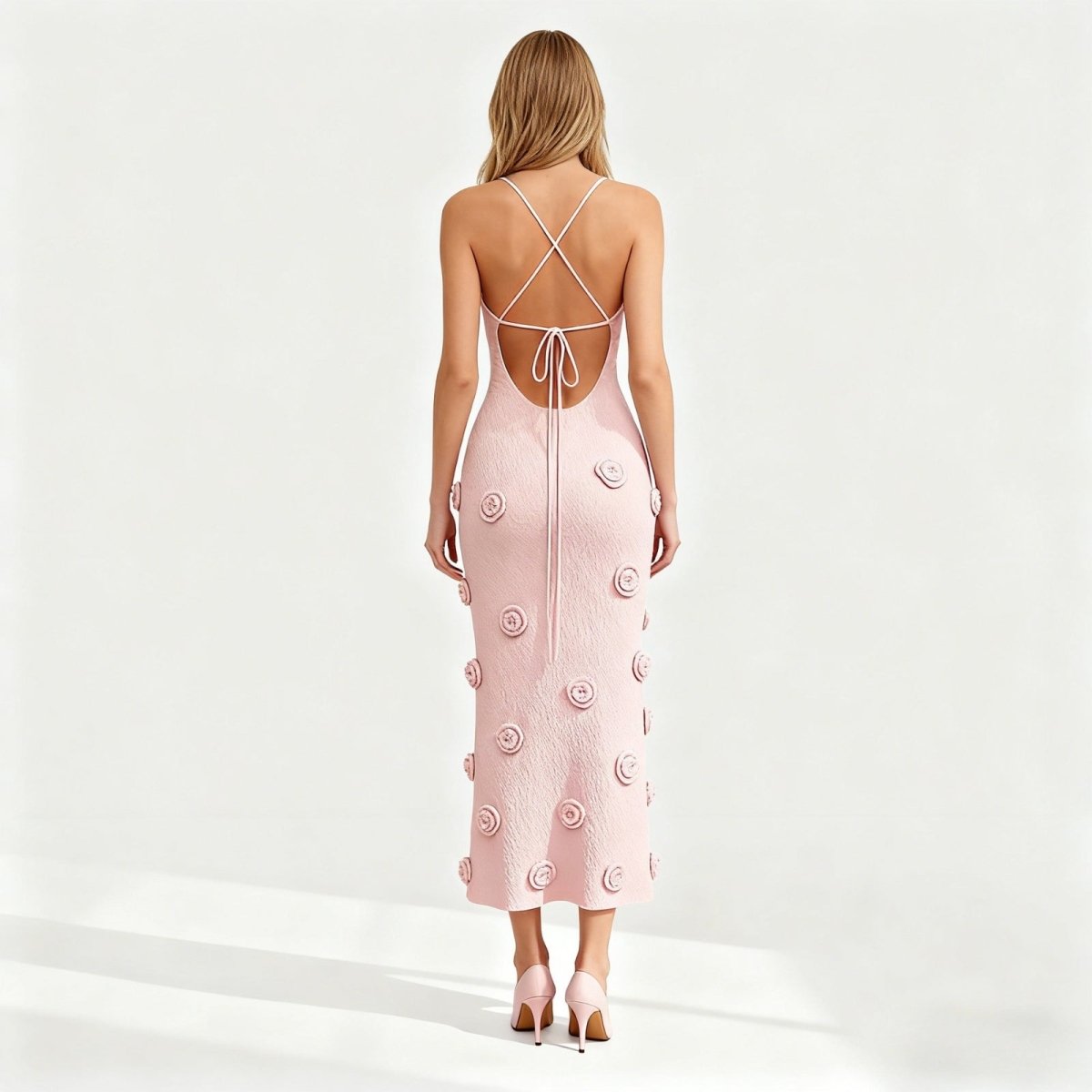 Pink dress with floral patterns on a white background