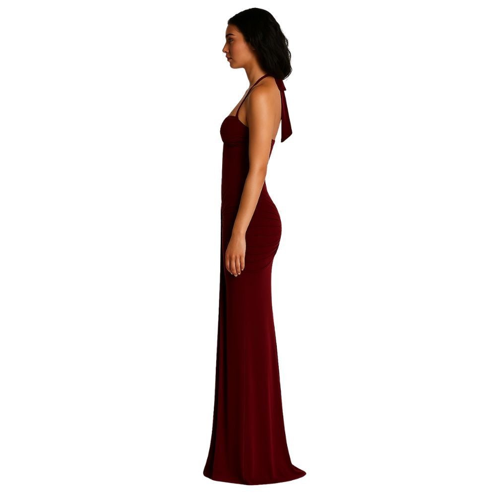 Burgundy kouvr evening gown with a bow detail on a white background