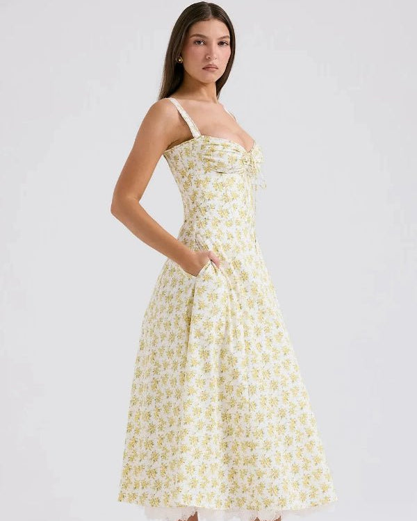 Kouvr's Aviva yellow floral vintage-inspired midi dress with sweetheart neckline and pockets
