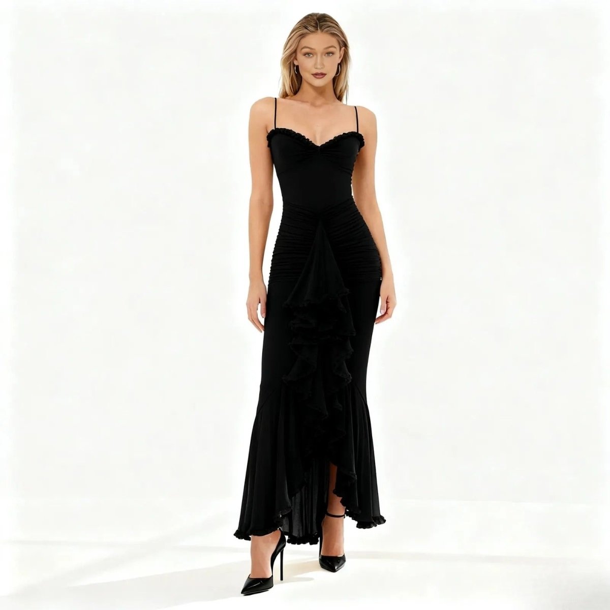 Woman wearing a black kouvr evening gown on a white background