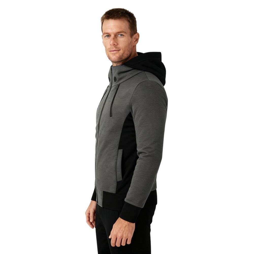 Man wearing a dark gray kouvr and black hoodie on a white background